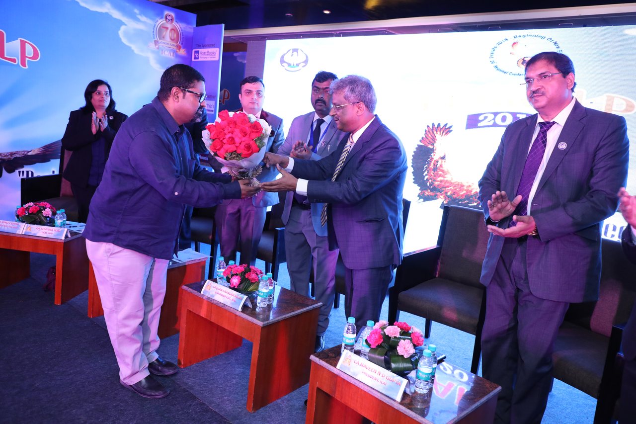 Ameet Mukherji welcomed on stage at an ICAI Platinum Jubilee event